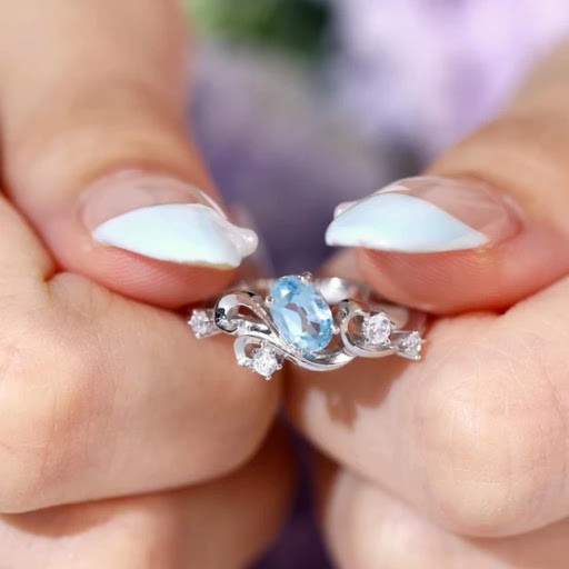 Azure Whimsy Sterling Silver Oval Sky Blue Topaz Swirl Ring