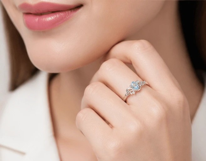 Azure Whimsy Sterling Silver Oval Sky Blue Topaz Swirl Ring